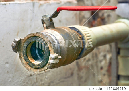 Plumbing. Sewerage. Water valve shutting off the water tap in the basement 113886910