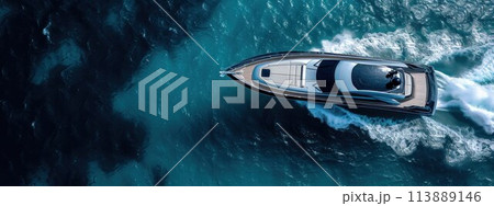 High aerial view of a motor speedboat traveling over blue ocean and leaving a trail of foam and bubbles 113889146