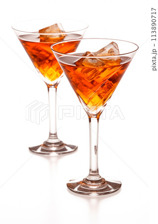 Refreshing Bourbon Manhattan cocktail with vermouth and maraschino cherry garnish isolated on white background 113890717