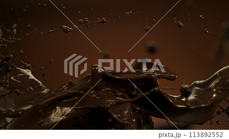 Melted Chocolate Splashes Flying in the Air. 113892552