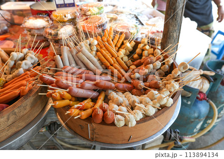 Steamed hot dogs and meatballs in a wooden tray,Food at the local market in Ao Nang City, Krabi Province 113894134