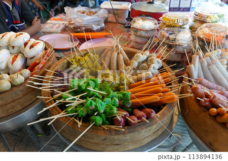 Steamed hot dogs and meatballs in a wooden tray,Food at the local market in Ao Nang City, Krabi Province 113894136