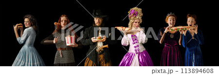 Collage made of people dressed like different medieval royal persons, knight and pirate, eating burgers, hot dogs and street food against black studio background. 113894608