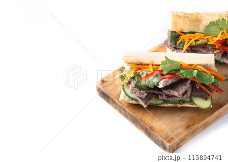 Vietnamese banh mi sandwich isolated on white background. Copy space Vietnamese banh mi sandwich isolated on white background. Copy space 113894741