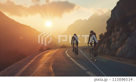 Group of cyclist ride together on road bicycles in beautiful nature. Sunset light, sea in background 113896514