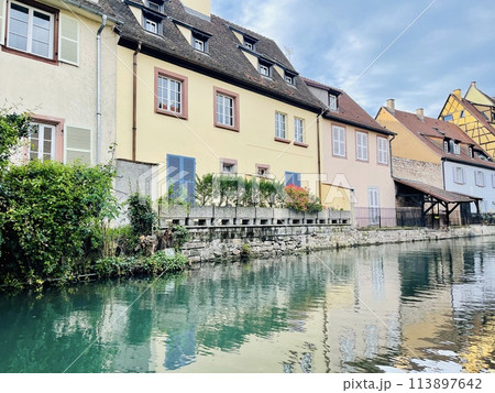 Urban medieval landscape of Alsace, water canal Colmar, France.  113897642