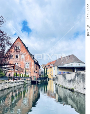 Urban medieval landscape of Alsace, water canal Colmar, France. Urban medieval landscape of Alsace, water canal Colmar, France. 113897722