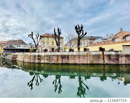 Urban medieval landscape of Alsace, water canal Colmar, France.  113897724