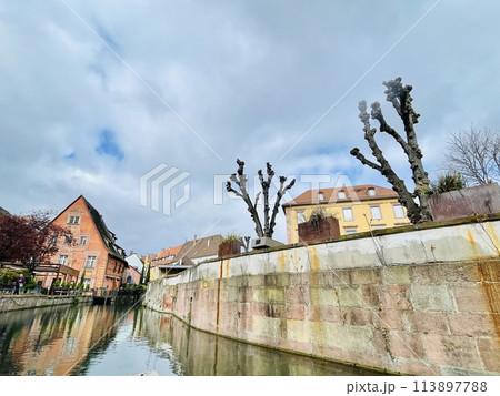 Urban medieval landscape of Alsace, water canal Colmar, France.  113897788