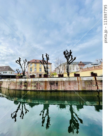 Urban medieval landscape of Alsace, water canal Colmar, France.  113897795