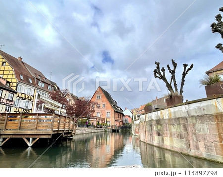 Urban medieval landscape of Alsace, water canal Colmar, France.  113897798