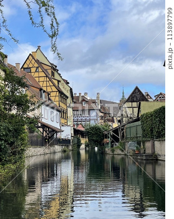 Urban medieval landscape of Alsace, water canal Colmar, France.  113897799