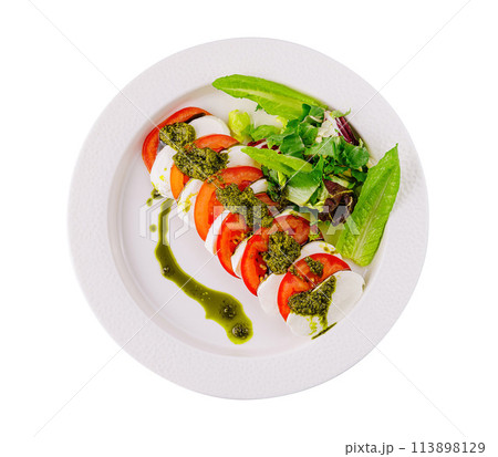 Fresh caprese salad with pesto drizzle Fresh caprese salad with pesto drizzle 113898129