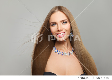 Happy fashionable jewelry woman fashion model with straight smooth healthy long hair, make-up Happy fashionable jewelry woman fashion model with straight smooth healthy long hair, make-up 113899470