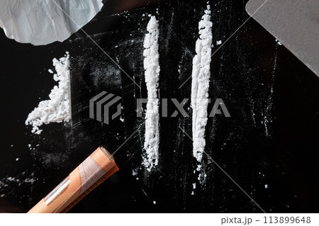 Two Cocaine lines prepared on a table 113899648