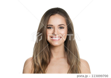 Smiling young female model with healthy hair, makeup and shiny clear skin posing 113899700