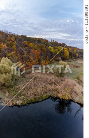 Aerial vertical river valley scenery in autumn 113899891