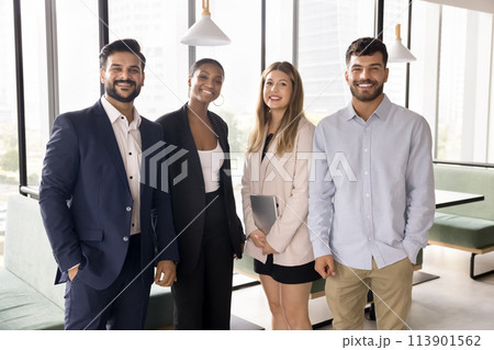 Happy multiethnic team of young business colleagues standing for portrait 113901562