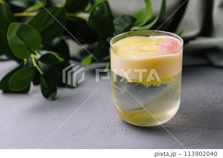 Refreshing citrus smoothie on modern kitchen counter 113902040