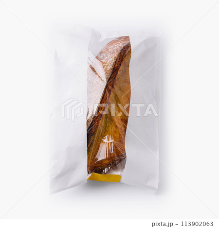Bread in paper bag on white background 113902063