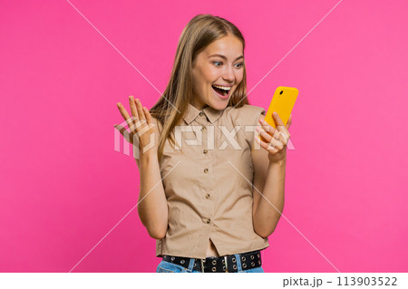 Happy excited winner woman use smartphone say wow yes found out great big win good news lottery 113903522