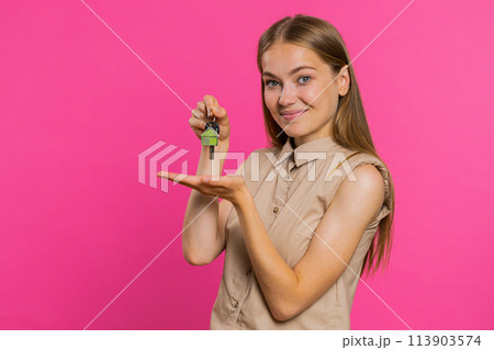 Woman real estate agent showing the keys of new home house apartment, buying or renting property Woman real estate agent showing the keys of new home house apartment, buying or renting property 113903574