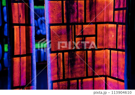 Labyrinth in neon light. Laser tag, paintball in the maze Labyrinth in neon light. Laser tag, paintball in the maze 113904610