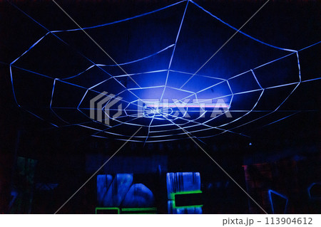 Labyrinth in neon light. Laser tag, paintball in the maze 113904612