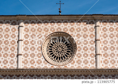 Typical Romanesque rose window of the portal of Basilica Santa Maria di Collemaggio in L'Aquila Typical Romanesque rose window of the portal of Basilica Santa Maria di Collemaggio in L'Aquila 113905775