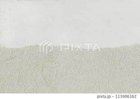 Two colors wall light white and beige plaster texture wall stucco blank background place text design empty Two colors wall light white and beige plaster texture wall stucco blank background place text design empty 113906162