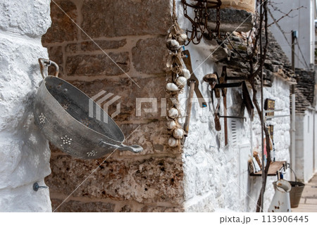 Picturesque decoration at the exterior of a Trullo in Alberobello, Southern Italy 113906445