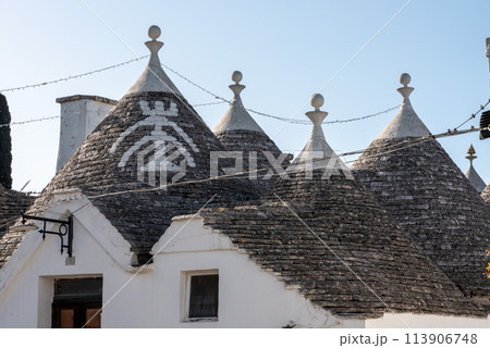 Iconic residential houses in historic Trulli district in Alberobello, Southern Italy 113906748