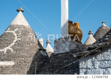 Scenic roofs of houses in historic Trulli district in Alberobello, Italy Scenic roofs of houses in historic Trulli district in Alberobello, Italy 113906798
