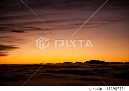 Spectacular sunset over a sea of clouds Spectacular sunset over a sea of clouds 113907534