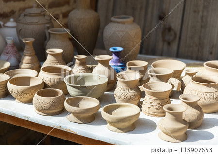 Clay earthenware represented at a street bazaar 113907653