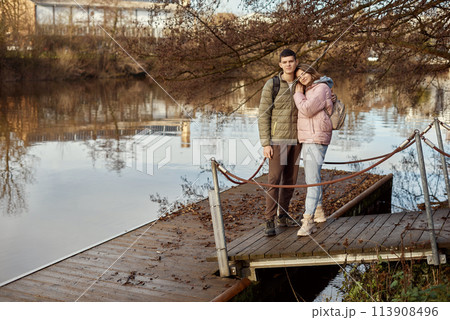 Embracing Moments: Beautiful 35-Year-Old Mother and 17-Year-Old Son in Winter or Autumn Park by Neckar River, Bietigheim-Bissingen, Germany 113908496