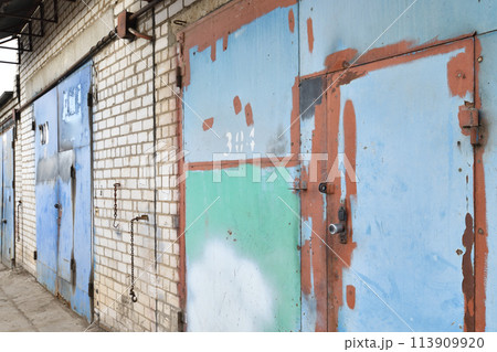 Brick garages with metal gates of garage cooperative in Russia Brick garages with metal gates of garage cooperative in Russia 113909920