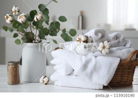 Basket full of white dirty towels for washing on blurred background of washing machine in bathroom. Concept allergy, natural detergent and chore. Close up. 113910190