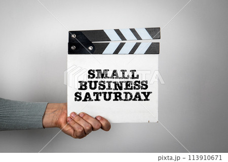 Small Business Saturday. Hand holding movie clapper 113910671