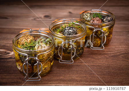 LABNEH CHEESE BOLLS WITH DRY MINT, BLACK AND WHITE SESAME, SUMAC AND ZAATAR IN A JAR WITH OLIVE OIL LABNEH CHEESE BOLLS WITH DRY MINT, BLACK AND WHITE SESAME, SUMAC AND ZAATAR IN A JAR WITH OLIVE OIL 113910787