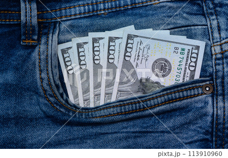 dollars bills lies in jeans pocket.money in wallet.savings.cash.international currency. 1 dollars bills lies in jeans pocket.money in wallet.savings.cash.international currency. 1 113910960