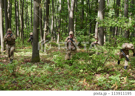 A specialized military antiterrorist unit conducts a covert operation in dense, hazardous woodland, demonstrating precision, discipline, and strategic readiness A specialized military antiterrorist unit conducts a covert operation in dense, hazardous woodland, demonstrating precision, discipline, and strategic readiness 113911195