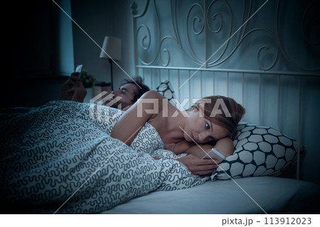 Problems in relationship, couple in bed 113912023