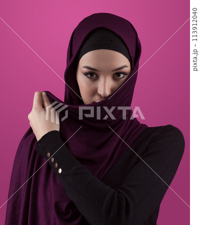 Modern Muslim woman wearing stylish hijab casual wear isolated on pink background. Diverse people model hijab fashion concept. 113912040
