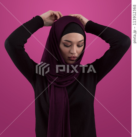 Modern Muslim woman wearing stylish hijab casual wear isolated on pink background. Diverse people model hijab fashion concept. 113912368