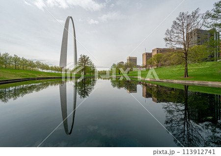 Gateway Arch reflected in reflecting pool in Gateway Arch National Park. Gateway Arch reflected in reflecting pool in Gateway Arch National Park. 113912741