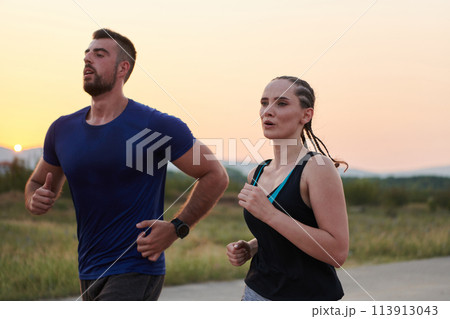 Dynamic Duo: Fitness-Ready Couple Embraces Confidence and Preparation for Upcoming Marathons Dynamic Duo: Fitness-Ready Couple Embraces Confidence and Preparation for Upcoming Marathons 113913043