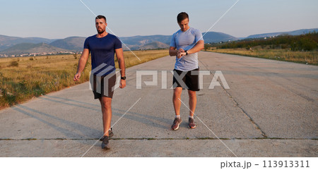 Marathon Partners: Two Athletic Friends Training Together for Upcoming Competition. Marathon Partners: Two Athletic Friends Training Together for Upcoming Competition. 113913311