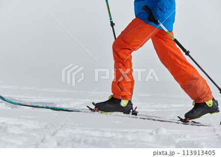 Close-Up of Ski Gear Ready for a Challenging Ascent 113913405