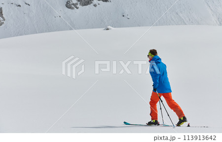 A Skier Scales a Treacherous Alpine Peak A Skier Scales a Treacherous Alpine Peak 113913642